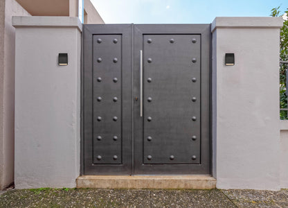 Raine Integrated LED wall sconce in black