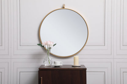 Metal frame round mirror with decorative hook 21 inch in Brass