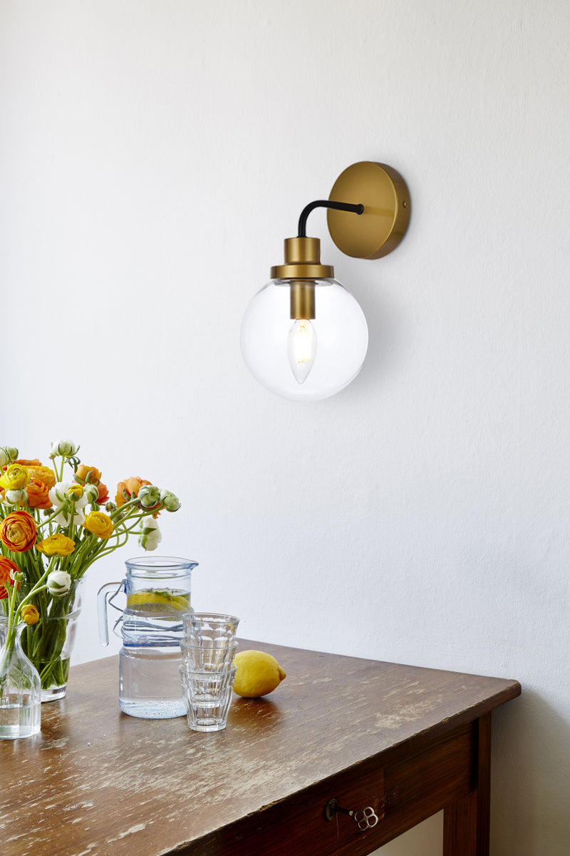 Hanson 1 light bath sconce in black with brass with clear shade