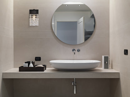 Phineas 1 light bath sconce in black with clear crystals