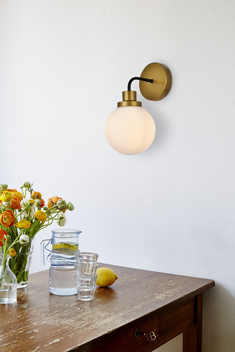 Hanson 1 light bath sconce in black with brass with frosted shade