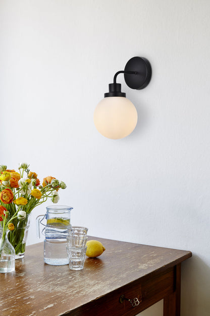 Hanson 1 light bath sconce in black with frosted shade