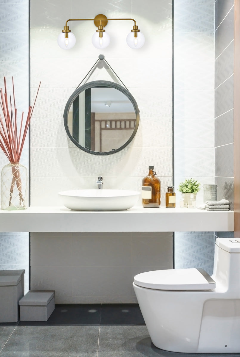 Hanson 3 lights bath sconce in brass with clear shade