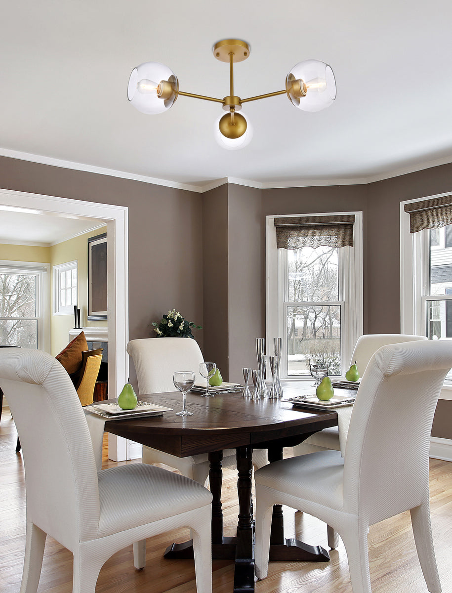 Briggs 26 inch flush mount in brass with clear shade